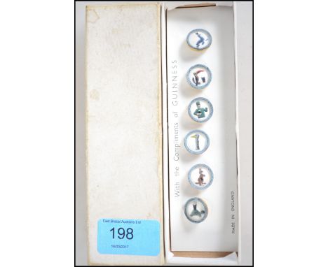An original set of Guinness waistcoat buttons complete in the original packaging, each with enamel animal / people scenes