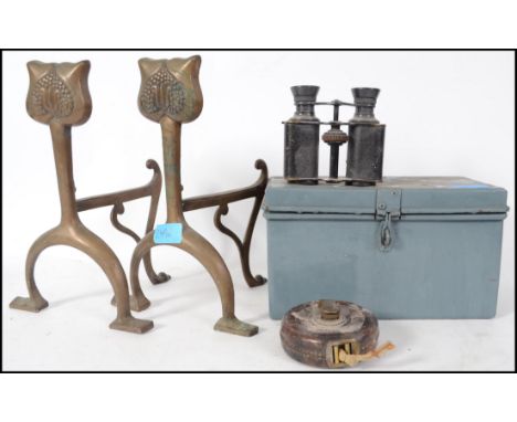 A pair of Arts & Crafts brass firedogs together with a metal deed box, vintage Timex watch, binoculars and a leather cased ta