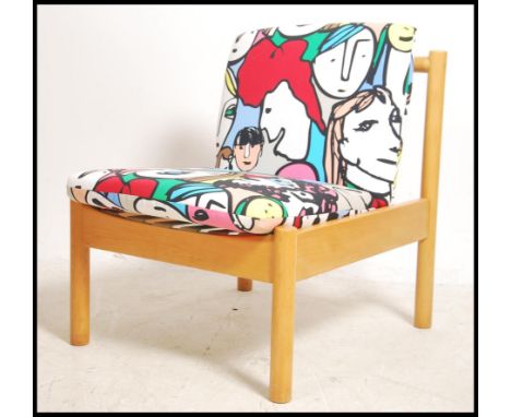 A retro 20th century low Ercol staff industrial school chair. Rasied on turned supports with new upholstered seat and back re