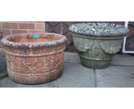 A well weathered antique style garden planter of reconstituted stone together with another cast terracotta cylindrical plante