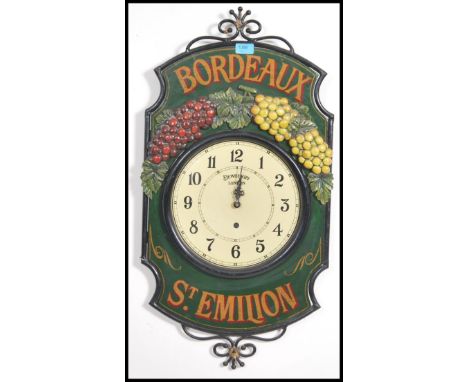 A vintage French style Bordeaux St Emillion advertising clock having grape and vine detail, the clock face having Roman numer