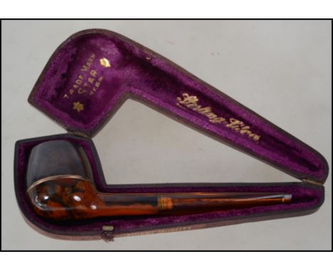 A good gentlemans sterling gilt silver banded amber smokers / smoking pipe by Star. Complete with the original leather and ve