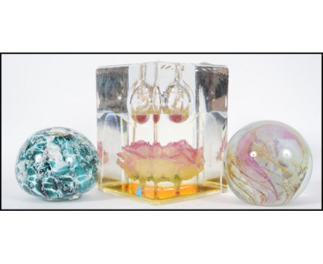 A collection of three paper weights to include an Isle of Wight example, a square form oil lamp. Measures: 13cms high. 