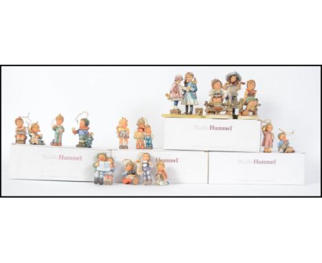 A collection of Studio Hummel figurines - Christmas decorations still in the original boxes with certificates to include