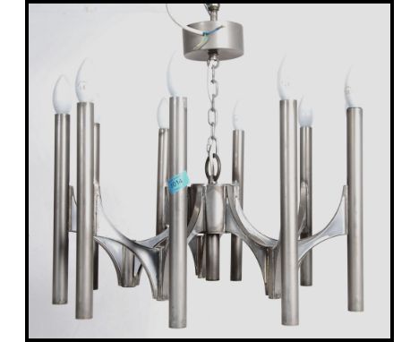 A 20th century retro ceiling chandelier constructed of cylindrical polished steel drops united by central mount with bracket 