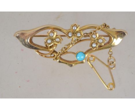 A 9ct gold vintage Art Nouveau ladies turquoise and seed pearl brooch with pin verso being marked 9ct . weight 2.8g