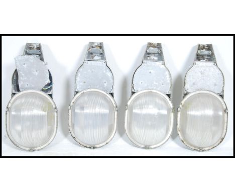 A group of four vintage mid century industrial Phosco lighting street lamps in grey. Measures 56cm high x 27cm wide x 20cm de