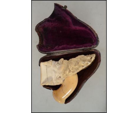 A 19th century cased meerschaum pipe end in the form of a scholar - headmaster. Complete in the original leather case ( see i