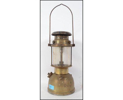 A vintage early 20th century tilley lamp in gilded metal form with glass intact ( see illustrations ) 