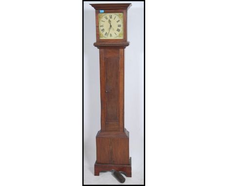 A Victorian painted face oak longcase / grandfather clock. The painted face with secondary aperture, faceted hands and roman 