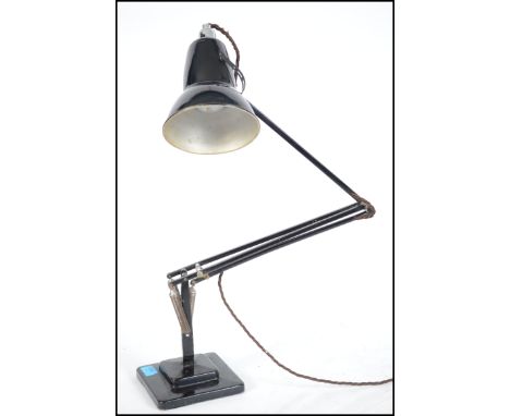 A vintage Herbert Terry anglepoise 1227 model Industrial desk lamp in original black paint raised on square terraced base wit