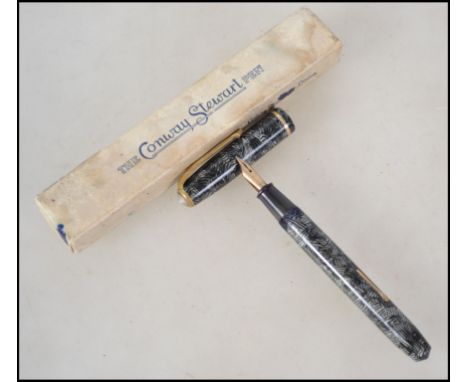 A boxed vintage 20th century Conway Stewart lever fill fountain / ink pen having a 14k k gold nib together with a Conwy Stewa