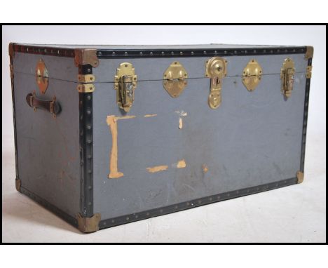 A 20th century contemporary grey steamer trunk chest having gilt metal clasps to centre. Hinged centre with lined interior. M