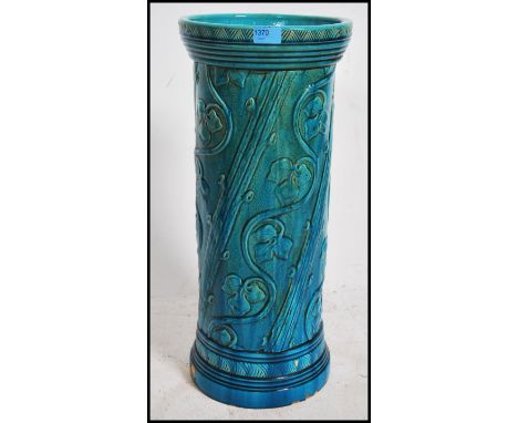 A stunning late 19th century Burmantofts Faience 808 umbrella / stick  stand of circular / cylindrical form moulded in the ae