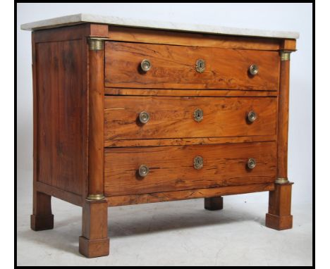 A 19th century French Empire chestnut / oak & marble top commode chest of drawers. Raised on block turned legs with columns a