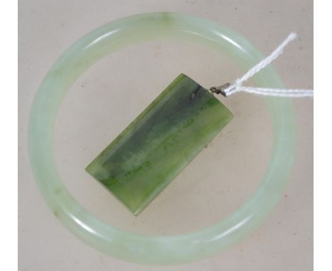 A 20th century Chinese ladies Jade bangle of roundel form ( see illustrations ) 