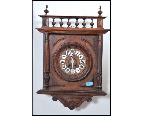 A Victorian oak cased country wall clock having enamelled pictorial numbers to the chapter ring with faceted hands all under 