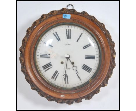 A Victorian French Oak cased Station wall clock with enamel painted dial with roman numeral chapter ring marked for Rollin of
