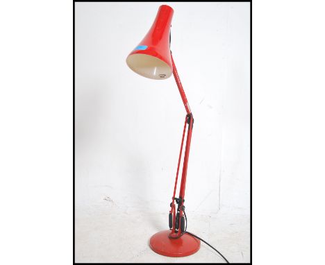 A 20th century retro Herbert Terry 90 anglepoise desk lamp in red with circular base and pendant shade