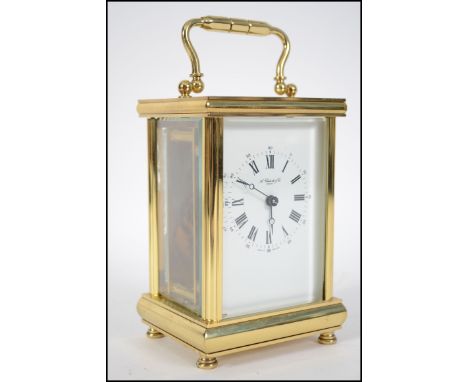 English brass cased carriage-clock, the case with Corinthian columns, rectangular dial with Roman numerals, signed A Chilcott