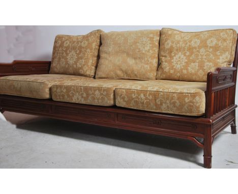 A 20th century Chinese influenced 3 seat sofa settee  having a gallery railed open frame with good over stuffed cushions. Ret