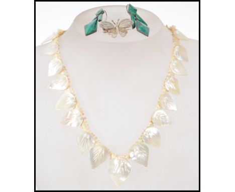 A stunning pair of 1920s Art Deco silver and malachite drop earrings along with a 1950s mother of pearl necklace having leaf 