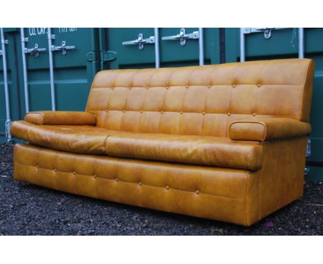 A stunning retro 1960's Danish three seater sofa. Having a vinyl button back upholstery in stunning condition with no rips or