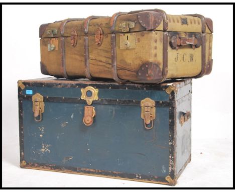 A vintage early 20th century Hegaro wooden bound canvas steamer trunk, with internal tray together with another vintage steam
