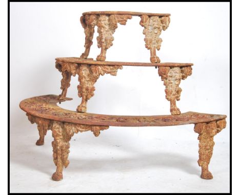 A 19th cenury Coalbrookdale style 3 tiered cast iron lattice worked plant stand , tree surround. Each tier cast in relief wit