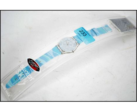 A collectable unused boxed James Bond 007 Thunder ball Skin Swatch Watch. Complete in case with paperwork.