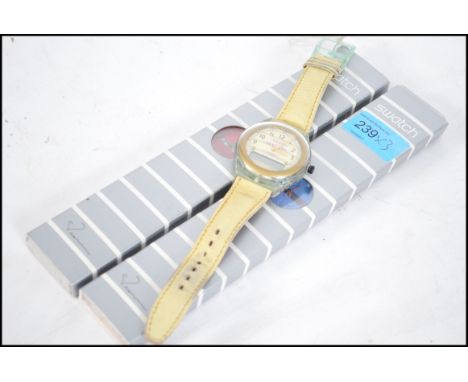 A group of three collectable Swatch watches to include to cased unused examples along with an unboxed Swatch ' The Beep ' wat