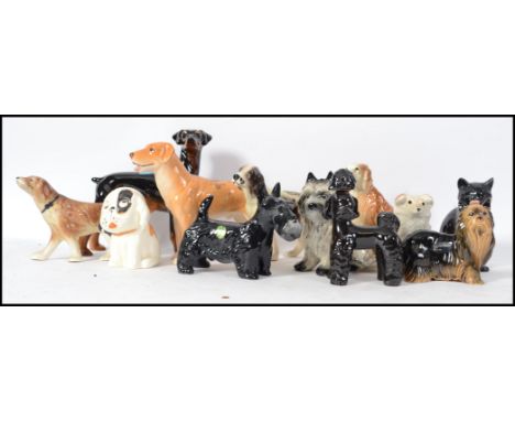 A collection of ceramic dog figurines to include scottie dogs, spaniels, terriers, retriever etc. Some by Melbaware, Trentham