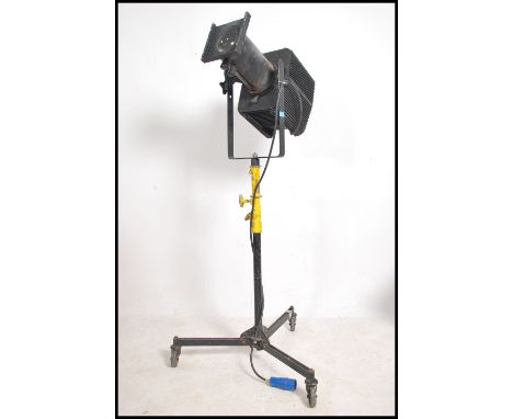 A large 20th century Industrial theatre light / cinema light complete with large metal folding tripod stand. The lamp being m