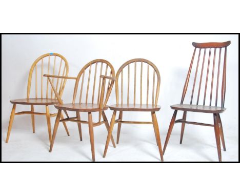 A collecton of 4 Ercol mid century dining chairs to include a   dark beech and elm wood chairs being utility marked also. Tog