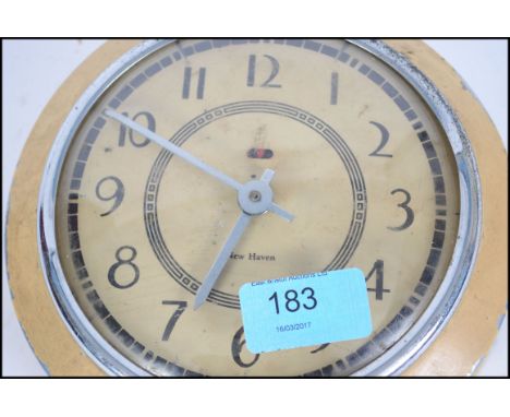A vintage 20th century New Haven electric wall clock, made in the USA. 
