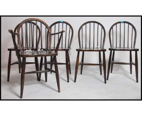 A set of 5 Ercol mid century dining chairs of dark beech and elm wood chairs being utility marked also. See illustrations  