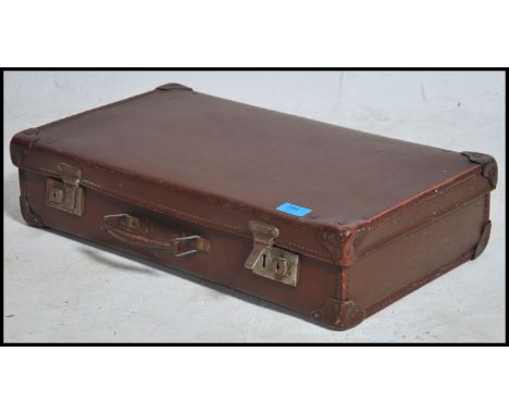 A vintage 20th century retro picnic hamper in original case consisting of green and blue plastic cups and plates, metal tins 