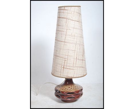 A large retro 20th century  West German style fat lava type table lamp having a large conical shade. 