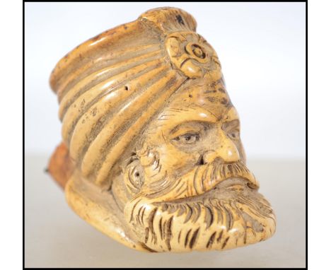 An unusual 19th century believed British Indian raj period meershaum pipe bowl in the form of an Indian bearded gentleman.