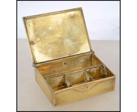 A 19th / early 20th century Ges Gesch continental brass stamp box having push button hinged release lid with sloped stamped a