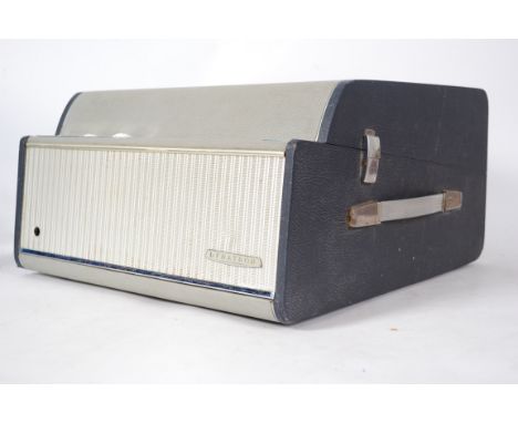 A vintage 20th century Dynatron four speed portable record player in a two tone finish. Carry handle to the side dials and sp
