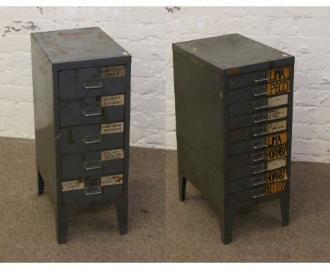 Two painted metal tool chests raised on bracket feet and containing assorted tools.