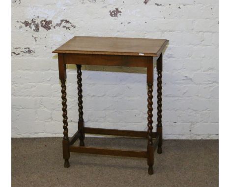 A light oak barleytwist occasional table.