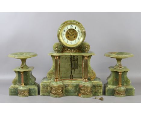 A C19th French onyx neo classical clock garniture with visible anchor escapement and mercury pendulum, housing an eight day c