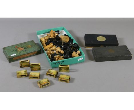 Eight painted tin matchbox holders, a larger example, carved wooden chess pieces and two boxes of playing cards including a s