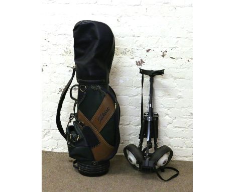 A Titleist golf bag and caddy.