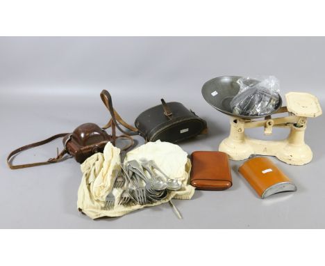 A cased pair of binoculars, camera, cigar case and whiskey flasks, a pair of kitchen scales and various flatware.