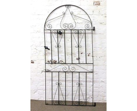 A wrought iron garden gate measuring 6x3 foot.