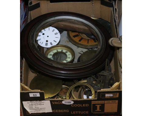 A box of clock spares including dials, bezels and gongs etc.