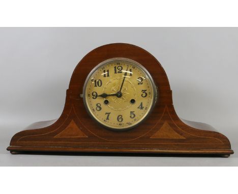 An Edwardian mahogany cased eight day mantel clock chiming half hourly on three gongs.